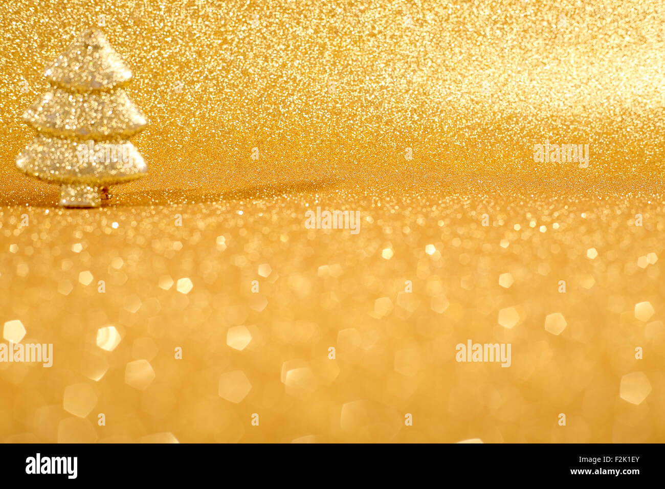 Golden christmas fir tree decoration on glitter background Stock Photo ...