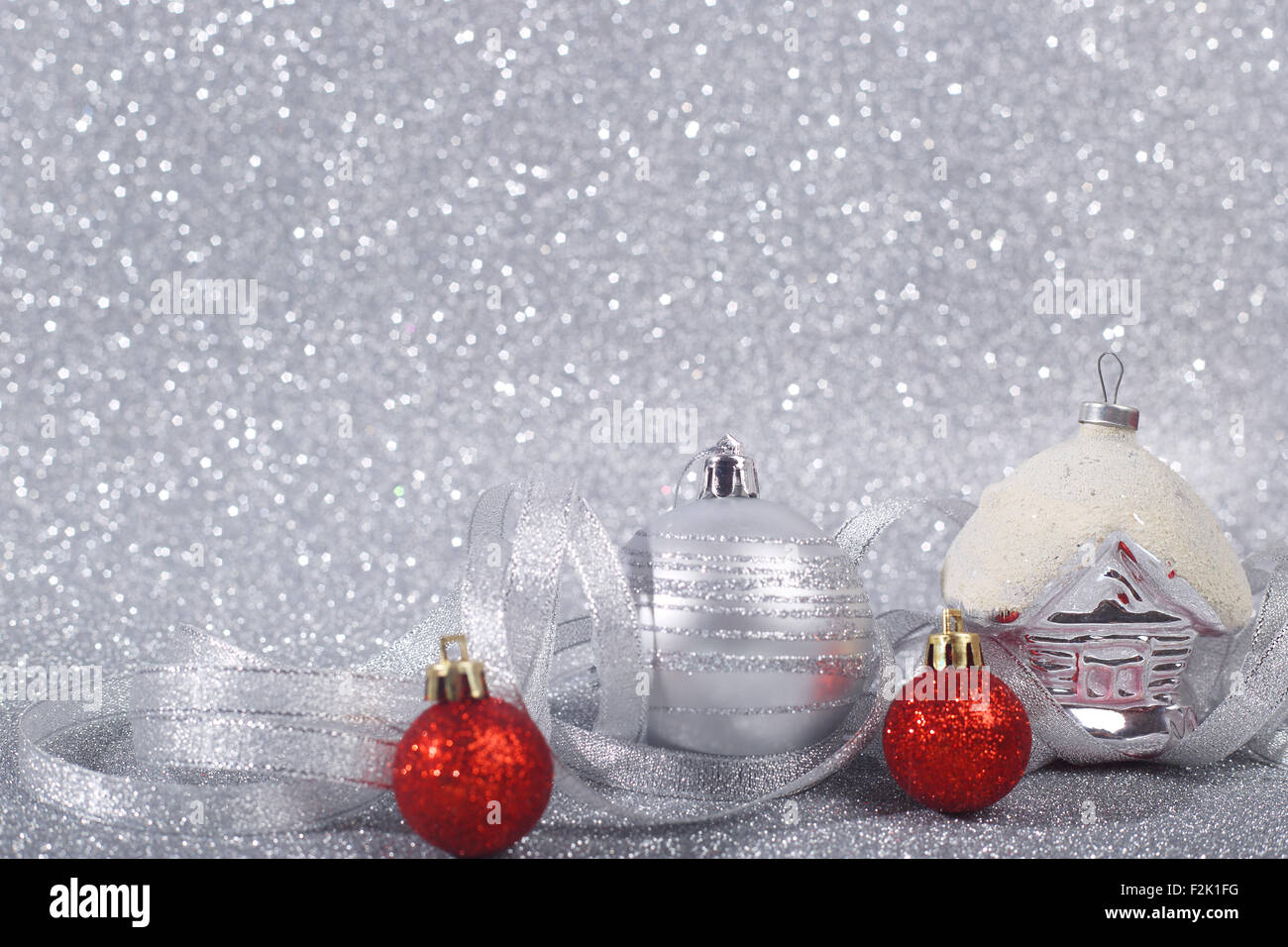 Beautiful red and silver christmas balls on glitter background with ...