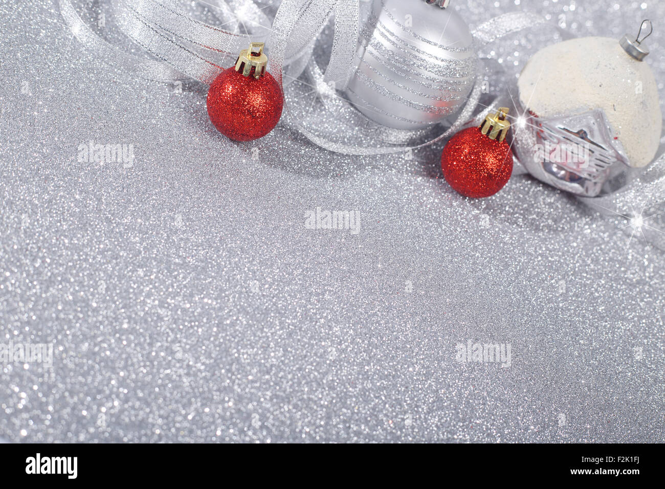 Beautiful red and silver christmas balls on glitter background with ...
