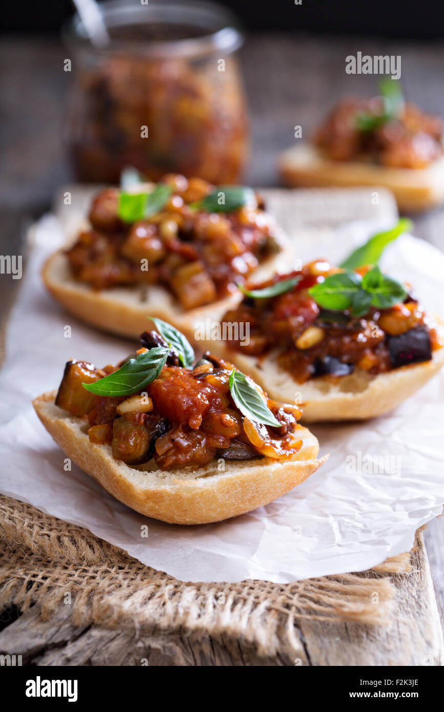 Eggplant and tomato caponata on crusty white bread Stock Photo Alamy