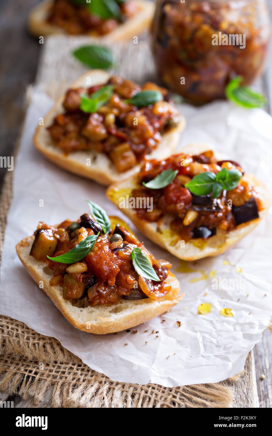 Eggplant and tomato caponata on crusty white bread Stock Photo Alamy