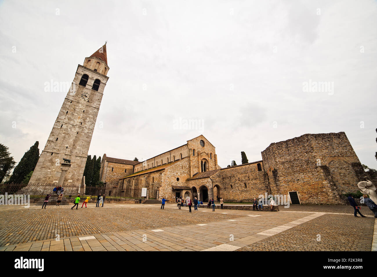 View of Basilica di Santa Maria Assunta and bell tower of Aquileia, Italy. Aquileia is UNESCO World Heritage Site Stock Photo