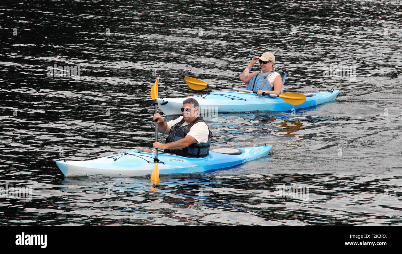 Husband wife couple in kayaks on Long Lake New York USA US America Adirondack State Park Adirondacks Stock Photo