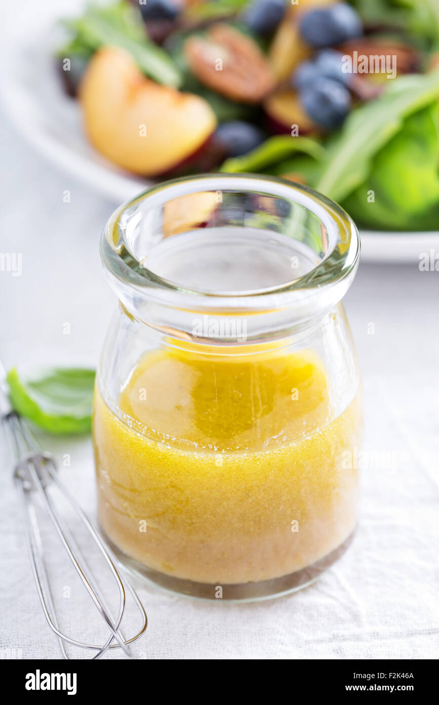 Salad dressing with olive oil, honey, mustard and vinegar Stock Photo Alamy