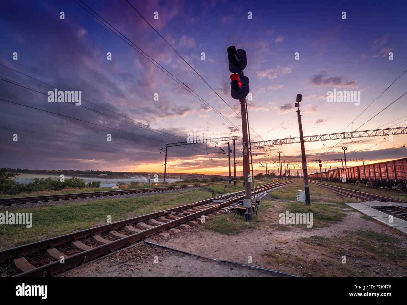Cargo train platform at sunset. Railroad in Ukraine. Railway station. Stock Photo