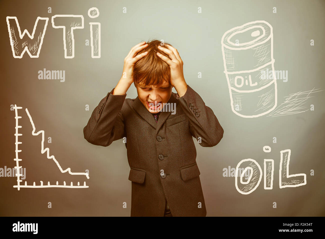 drop in the price of oil barrel WTI businessman teenager holding Stock Photo