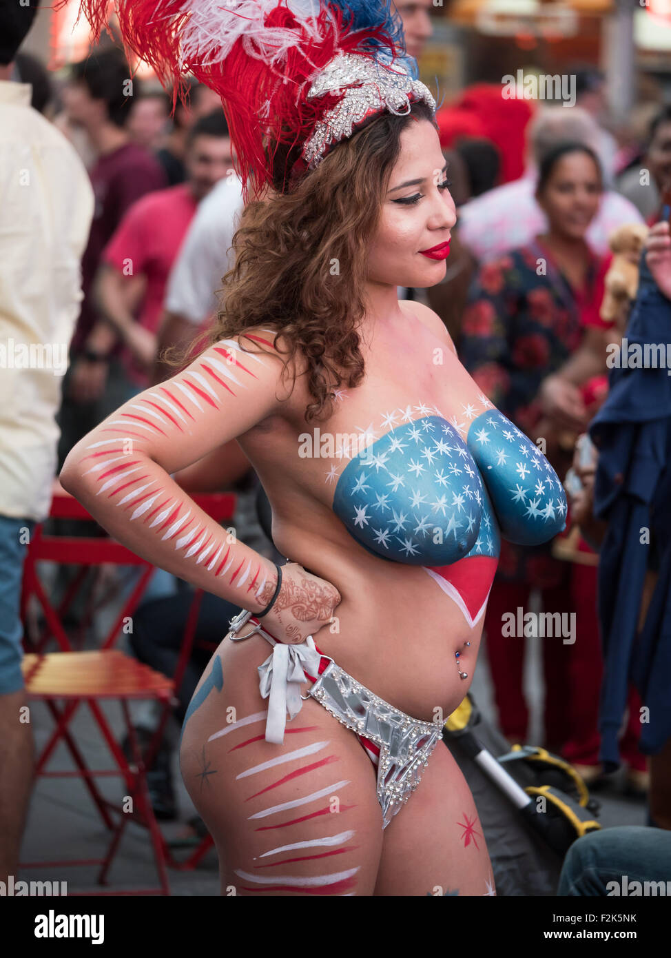 Lourdes Carrasquillo, a topless body-painted Desnuda, poses for an artist  in Times Square in New York City Stock Photo - Alamy