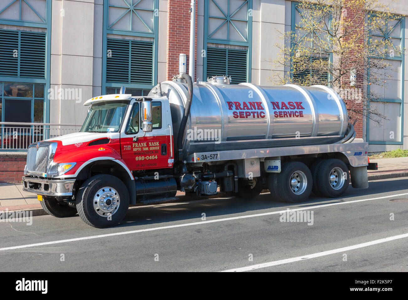 A Frank Nask Septic Tank Service truck makes a service stop in White Plains, New York. Stock Photo