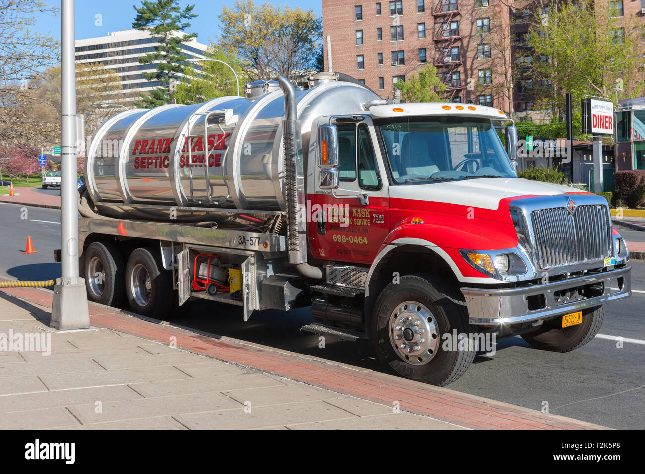 A Frank Nask Septic Tank Service truck makes a service stop in White Plains, New York. Stock Photo