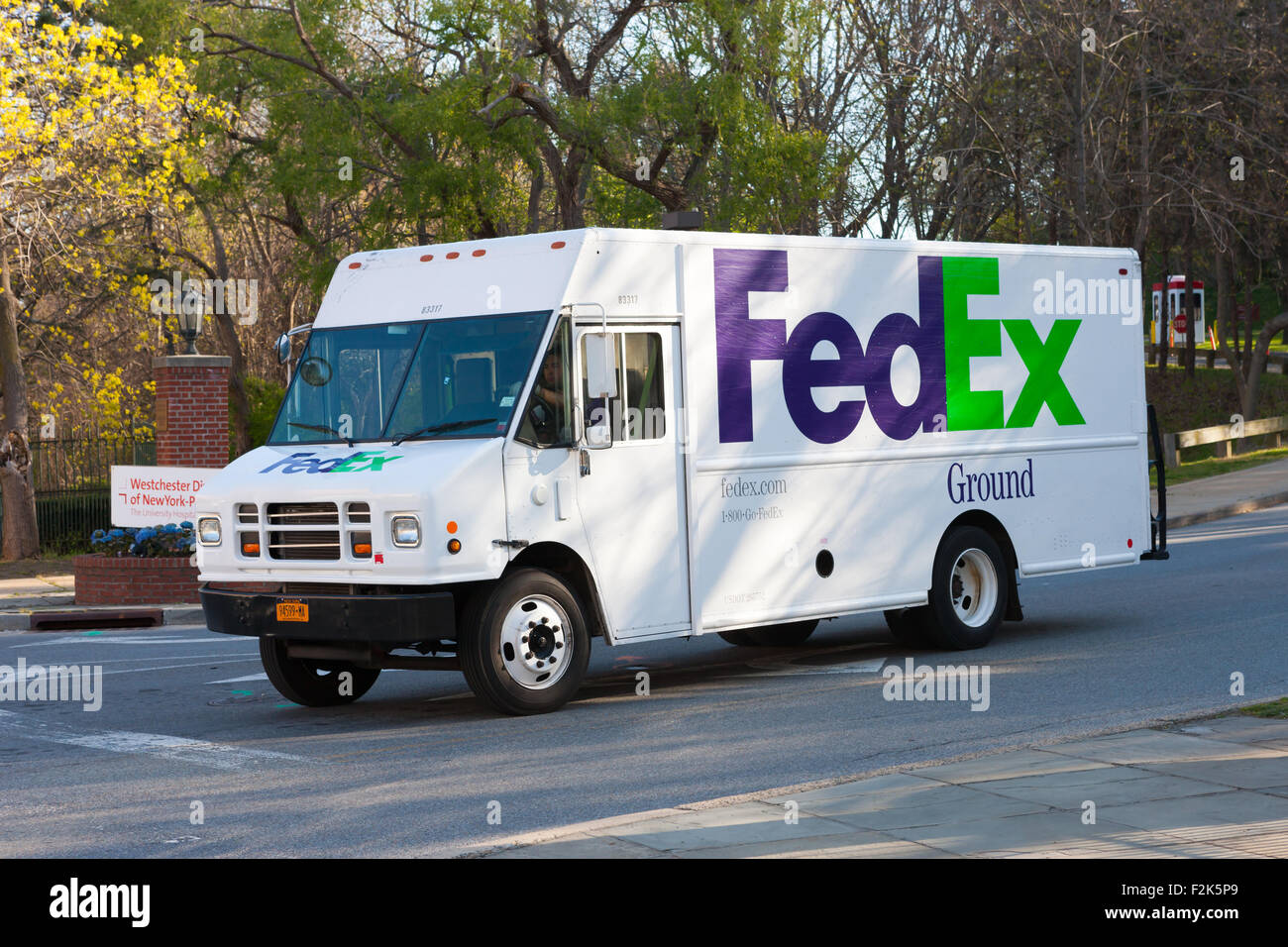 A FedEx Ground truck on its delivery route in White Plains, New York. Stock Photo