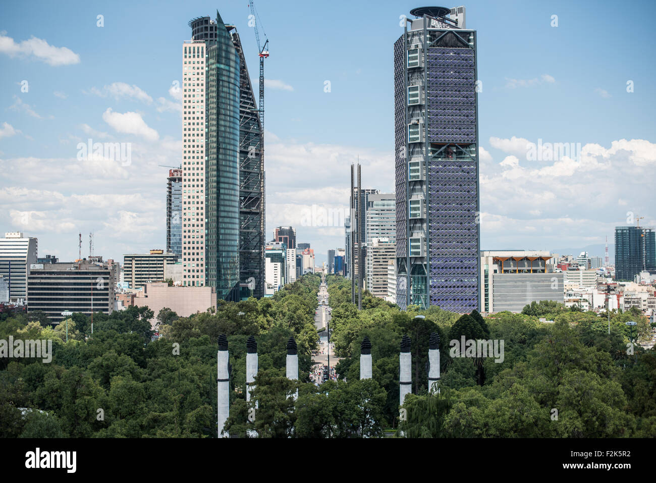 MEXICO City, Mexico - The view down Paseo de la Reforma, with new skyscrapers, from an outdoor patio area at Chapultepec Castle. Since construction first started around 1785, Chapultepec Castle has been a Military Academy, Imperial residence, Presidential home, observatory, and is now Mexico's National History Museum (Museo Nacional de Historia). It sits on top of Chapultepec Hill in the heart of Mexico City. Stock Photo