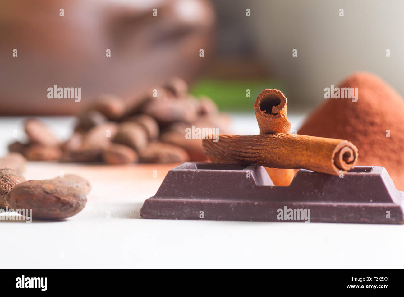 Close up of chocolate bar, cacao and cinnamon Stock Photo