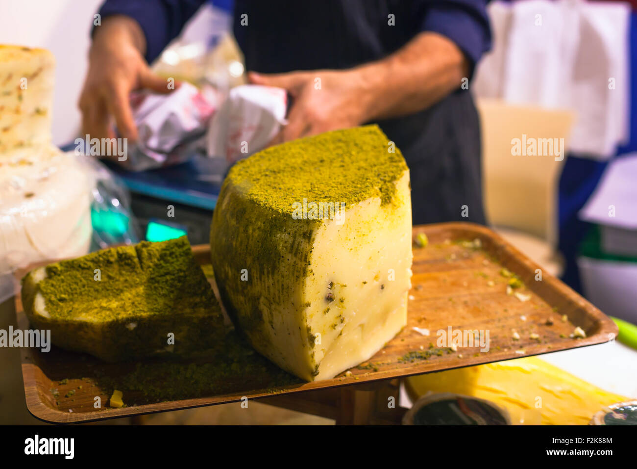 Sicilian cheese dressed with pistachio nuts grind Stock Photo