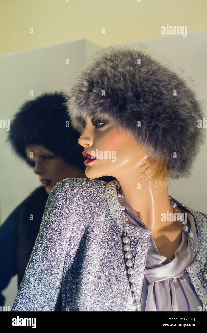 Female mannequin with fur hat in the boutique Stock Photo