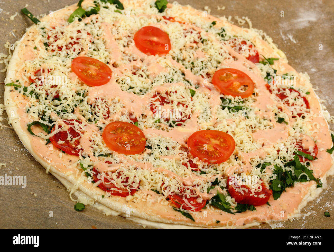 Making Pizza with Salami and Tomatoes Stock Photo Alamy