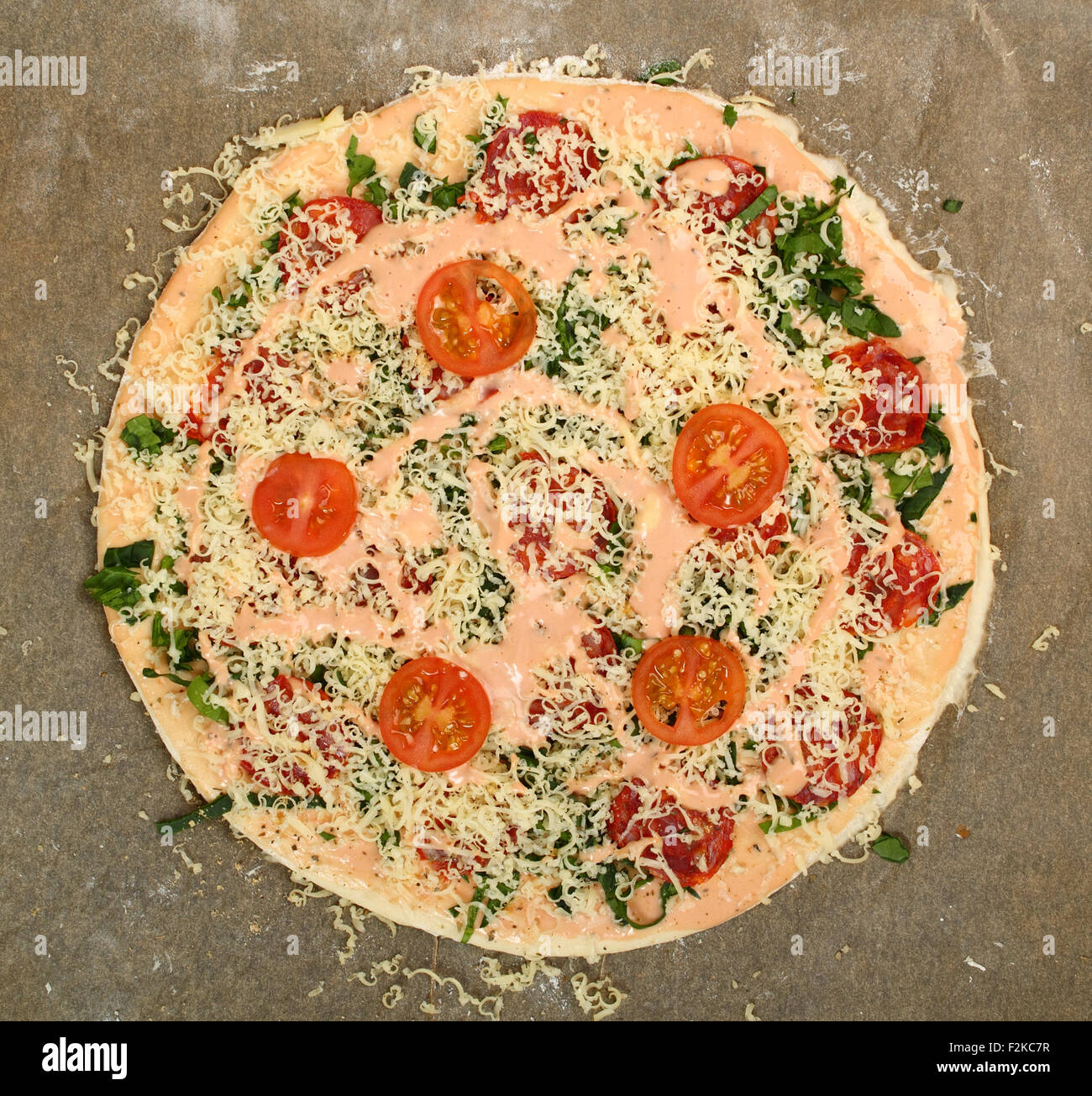 Making Pizza with Salami and Tomatoes Stock Photo Alamy