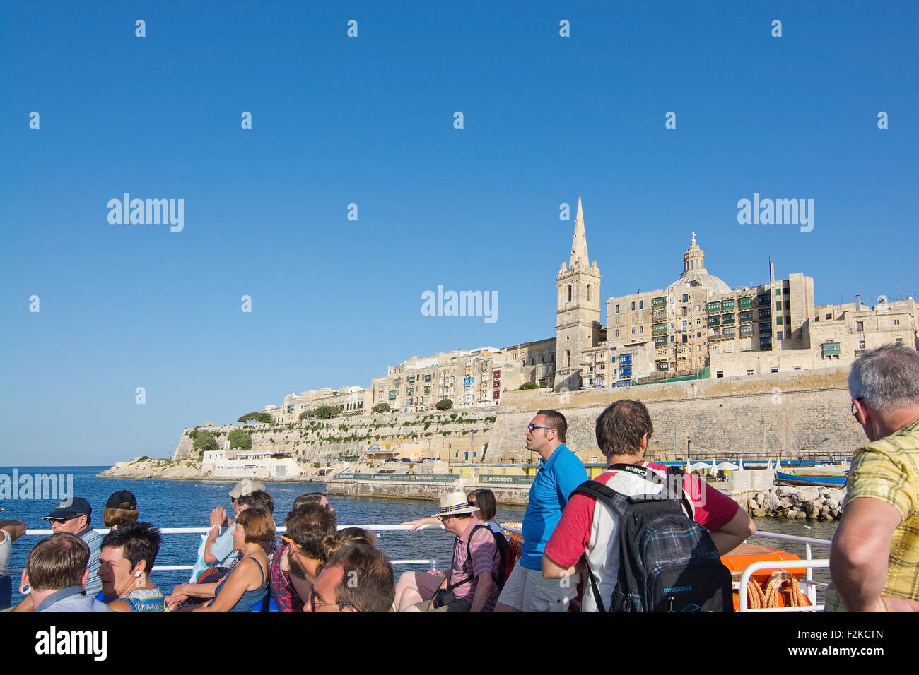 People on the commuter ferry en route from Valletta to Sliema. Stock Photo