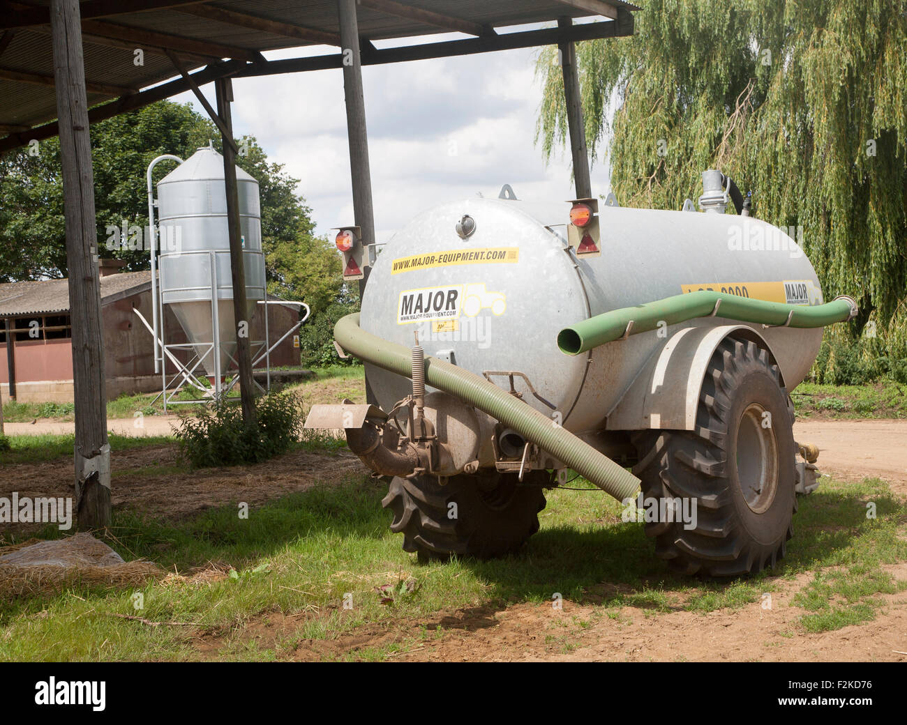 Muck spreader vehicle in pig farm hires stock photography and images