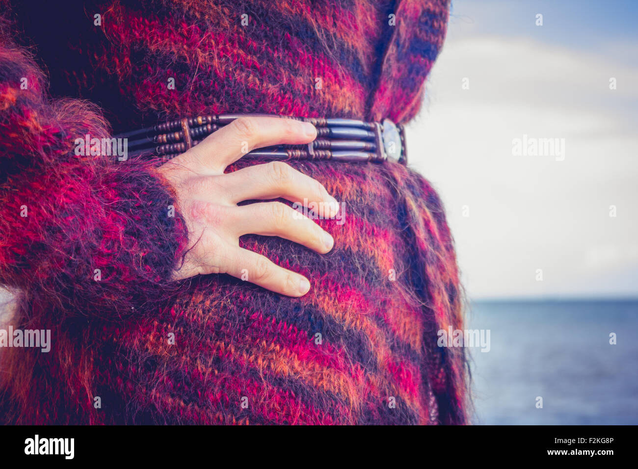 Woman standing by the sea Stock Photo - Alamy