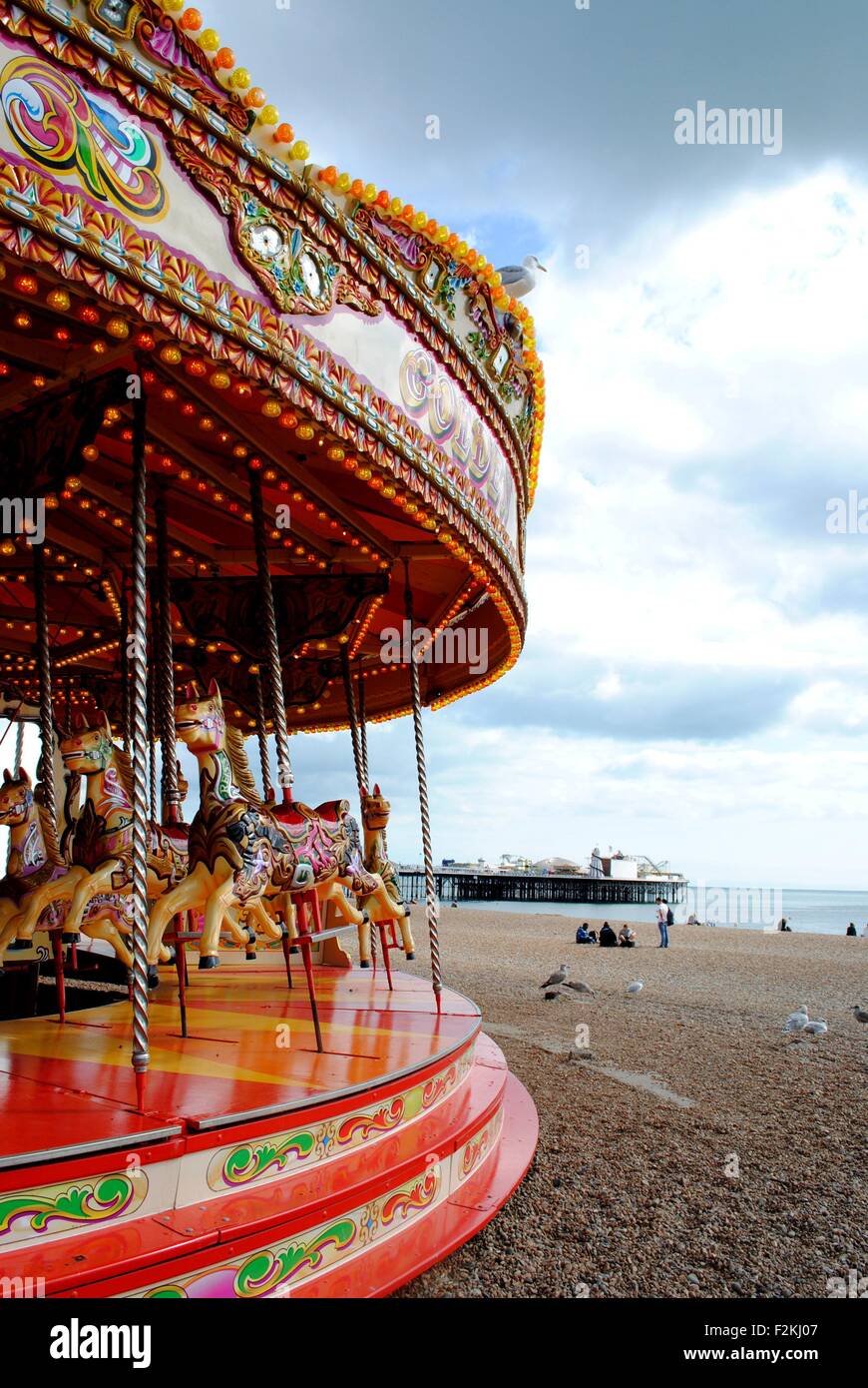 View of Brighton Pier from the carousel on Brighton beach Stock Photo