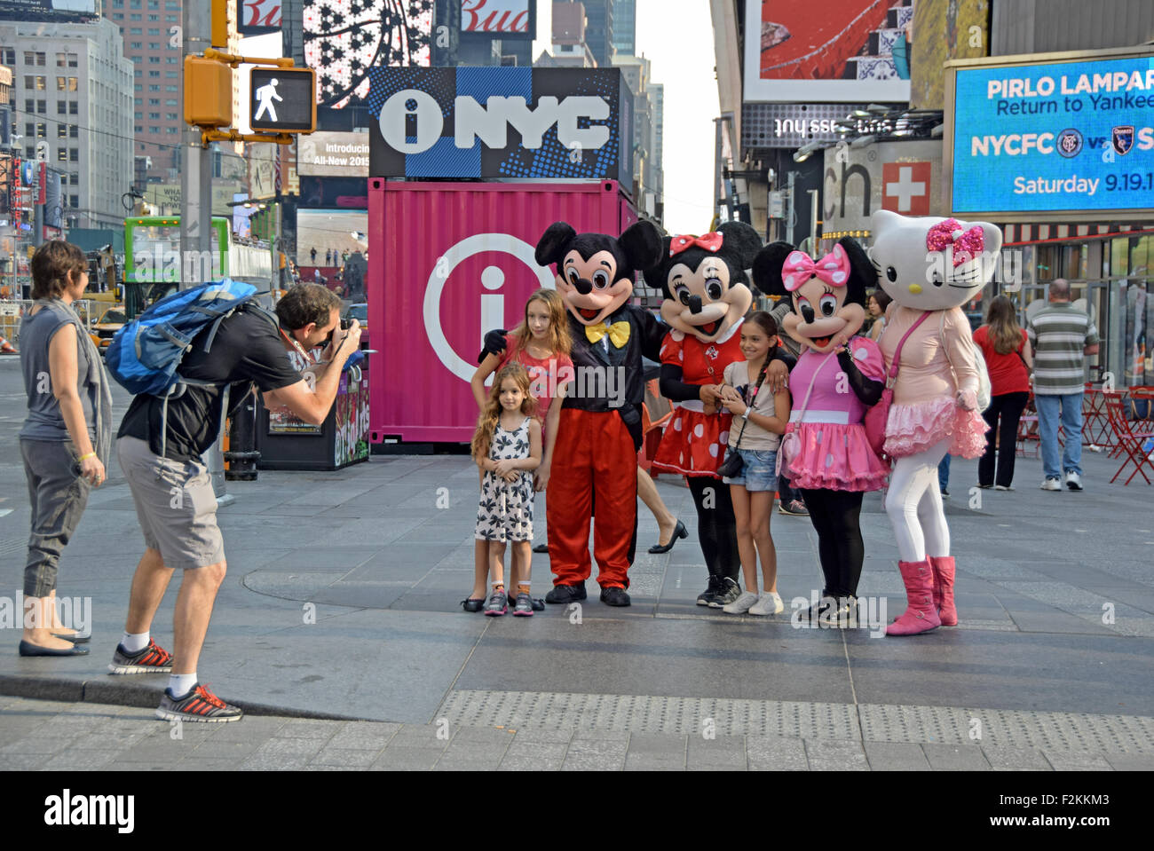Cartoon & comic characters solicit tourists in Times Square in New York to pose for photos in exchange for a tip. Stock Photo