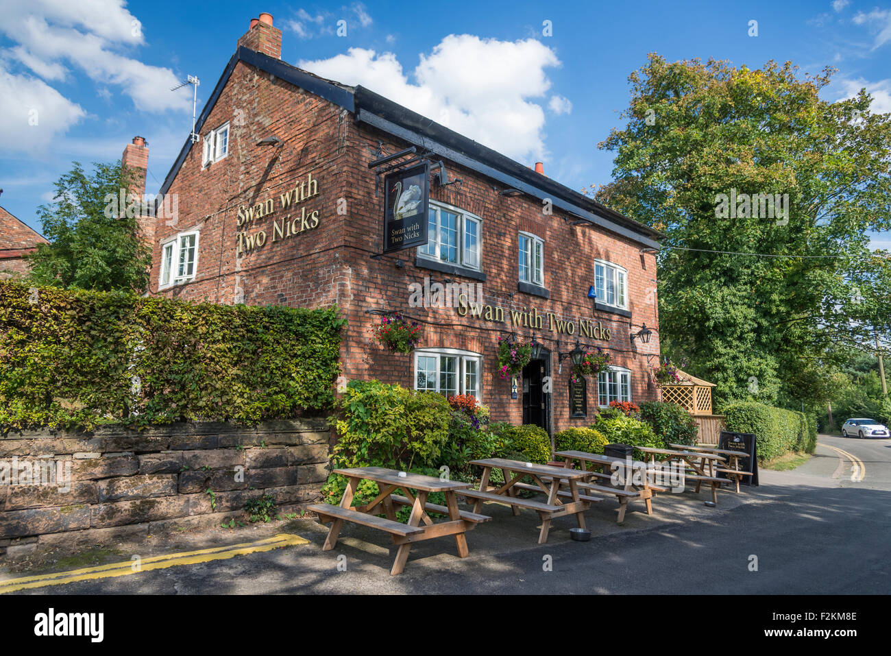 Public house the Swan with Two Nicks at Little Bollington in Cheshire North West England. Stock Photo