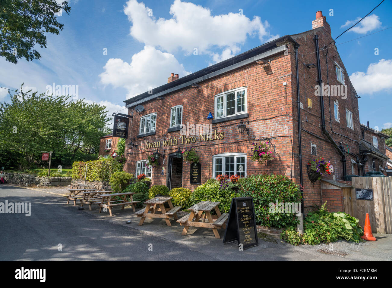Public house the Swan with Two Nicks at Little Bollington in Cheshire North West England. Stock Photo