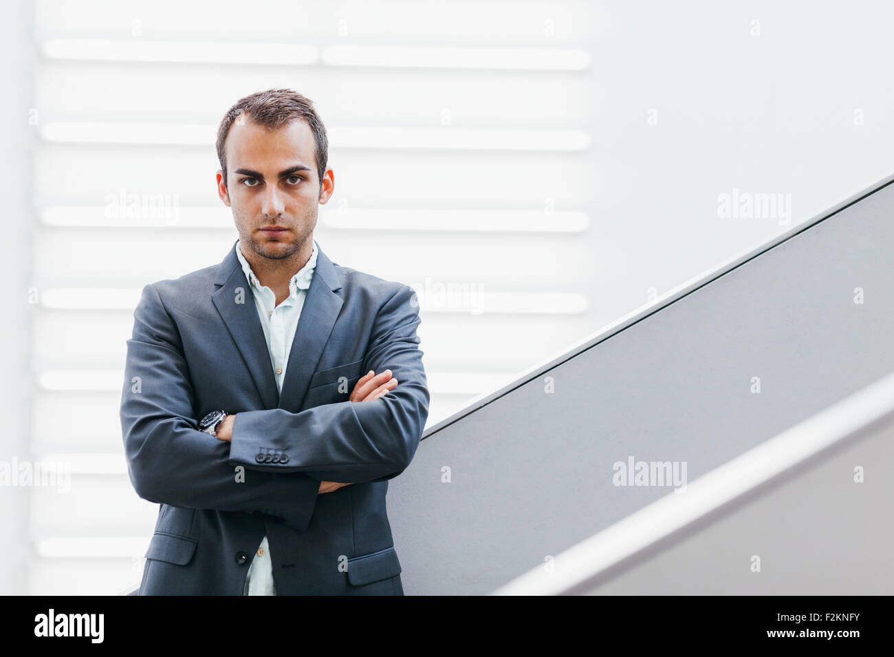 Portrait of businessman with crossed arms Stock Photo - Alamy