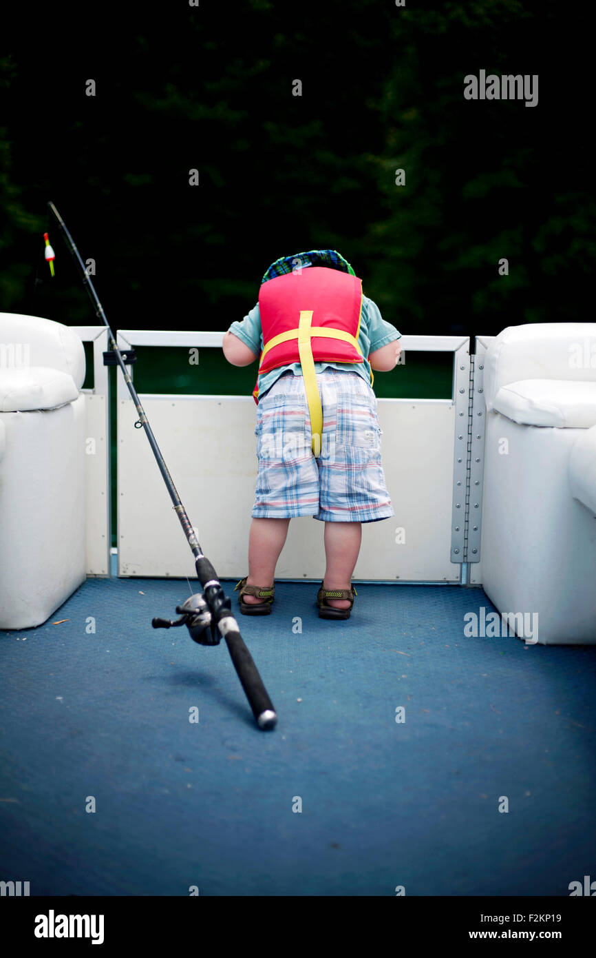 Little boy with life jacket on boat Stock Photo Alamy
