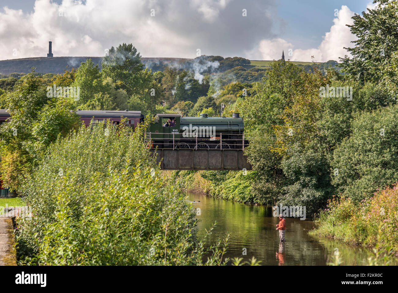 East Lancs Railway. WD Austerity Saddle Tank 75008 Swiftsure crossing the river Irwell approaching Ramsbottom station. Stock Photo