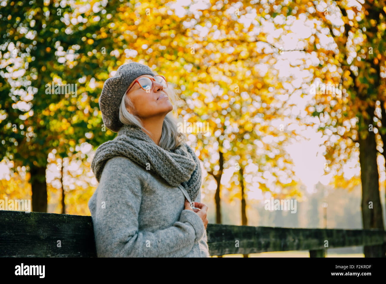 Woman wwith closed eyes in an autumnal park Stock Photo - Alamy