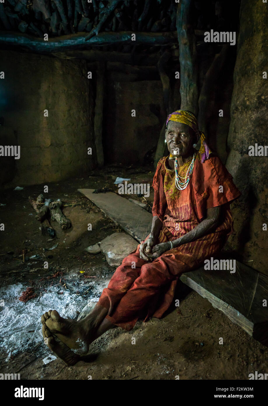 Togo, West Africa, Nadoba, old woman inside a traditional tata somba house Stock Photo