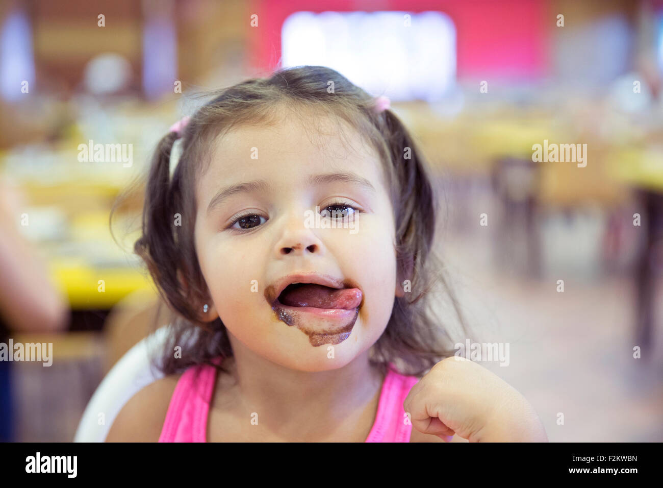 Portrait of little girl covered with ice cream Stock Photo