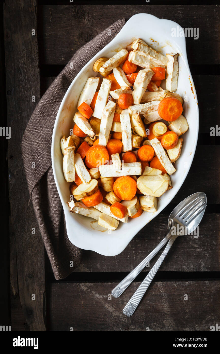 Roasted root vegetable, carrot, parsnip and celeriac on casserole dish
