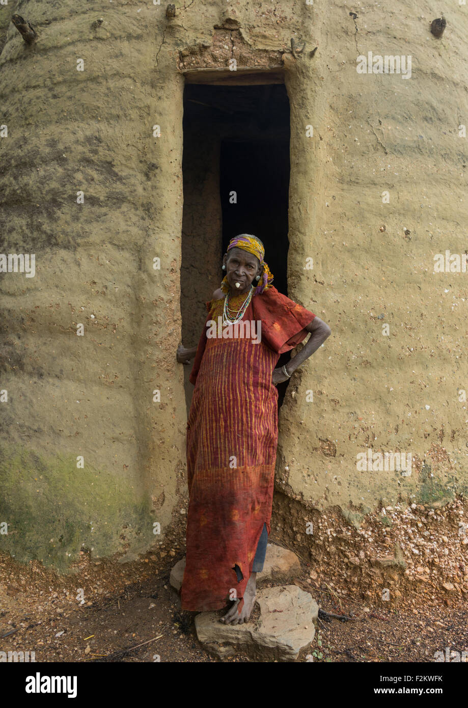 Togo, West Africa, Nadoba, woman in front her traditional tata somba house Stock Photo