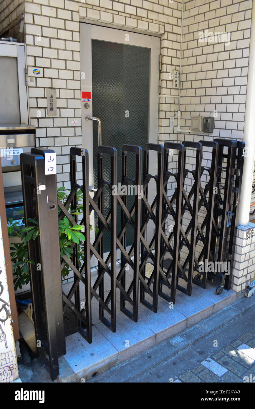 Collapsible metal fence. Harajuku, Tokyo. Stock Photo