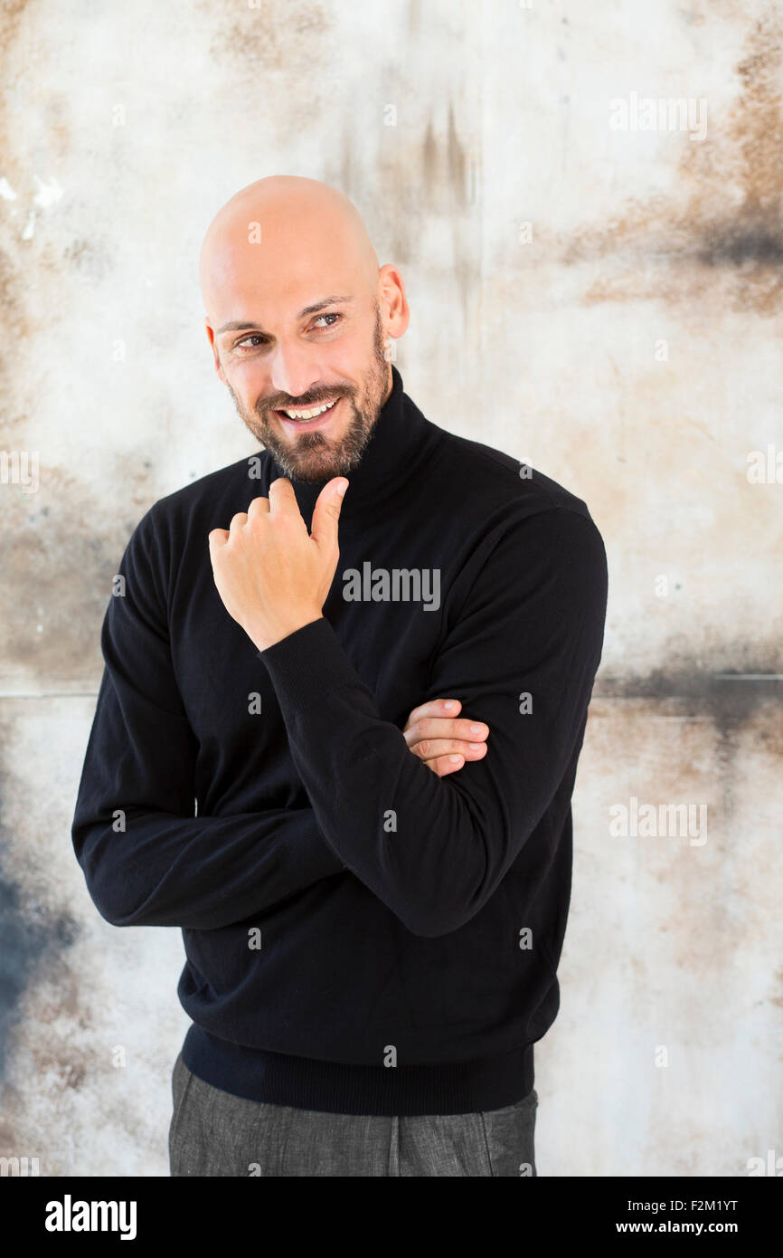 bald man turtleneck