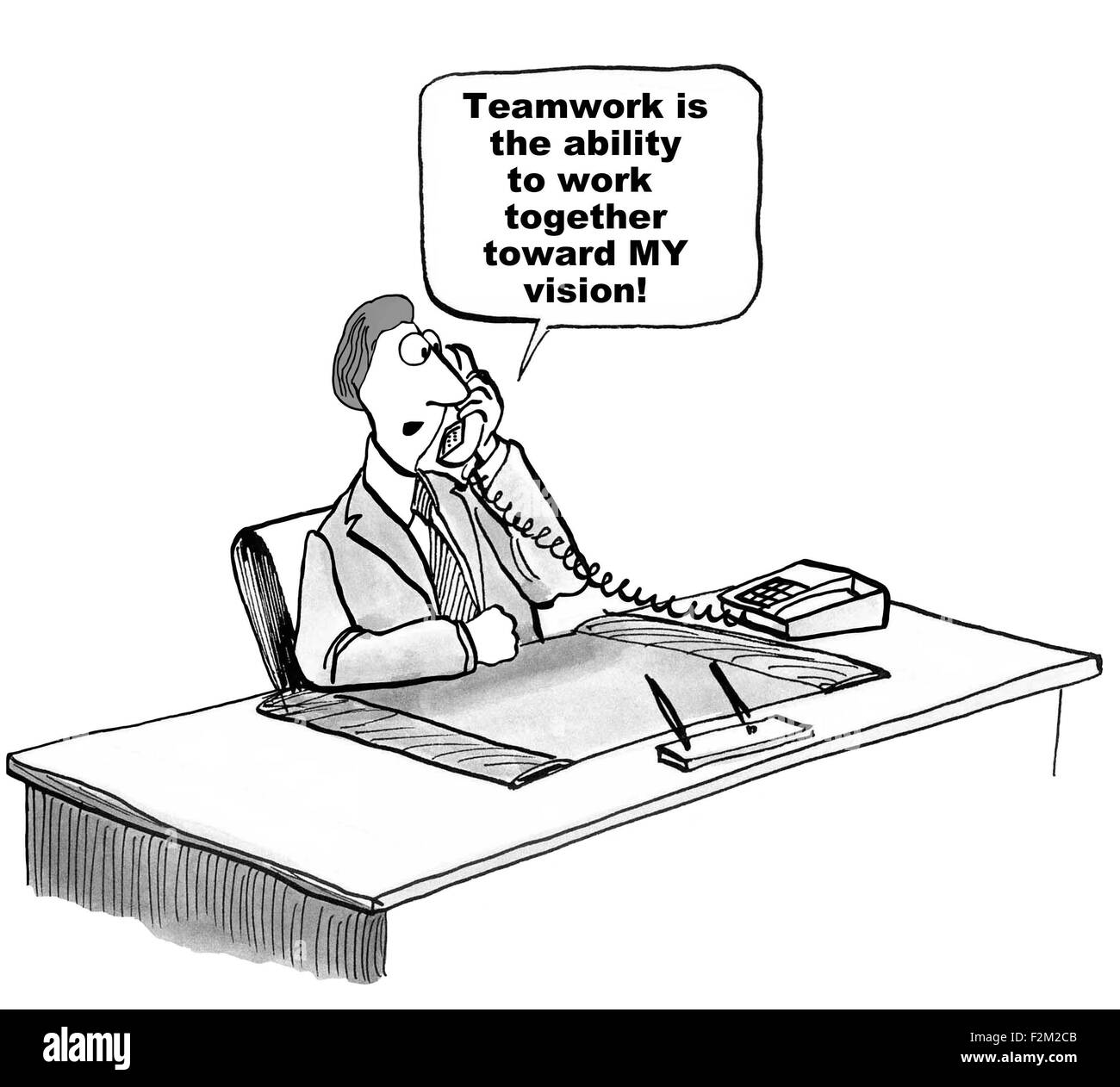 Business cartoon of manager saying, 'Teamwork is the ability to work together toward MY vision'. Stock Photo