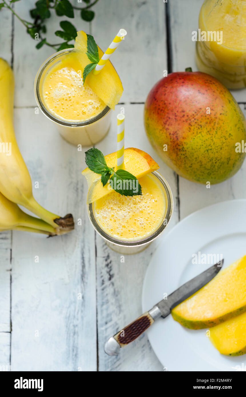 Two glasses of mango banana smoothie Stock Photo
