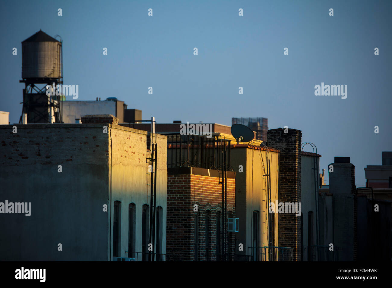 USA, New York City, Old water tanks on rooftops in East Village Stock Photo