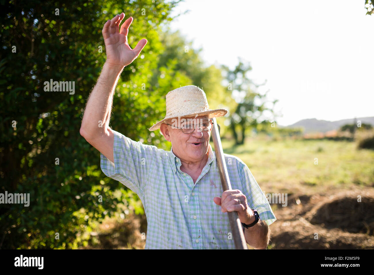 Portrait of greeting farmer Stock Photo - Alamy