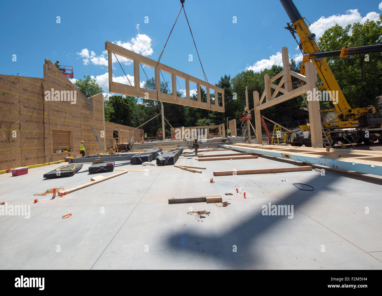 16,000 pound wooden engineered timber trusses await installation by ...