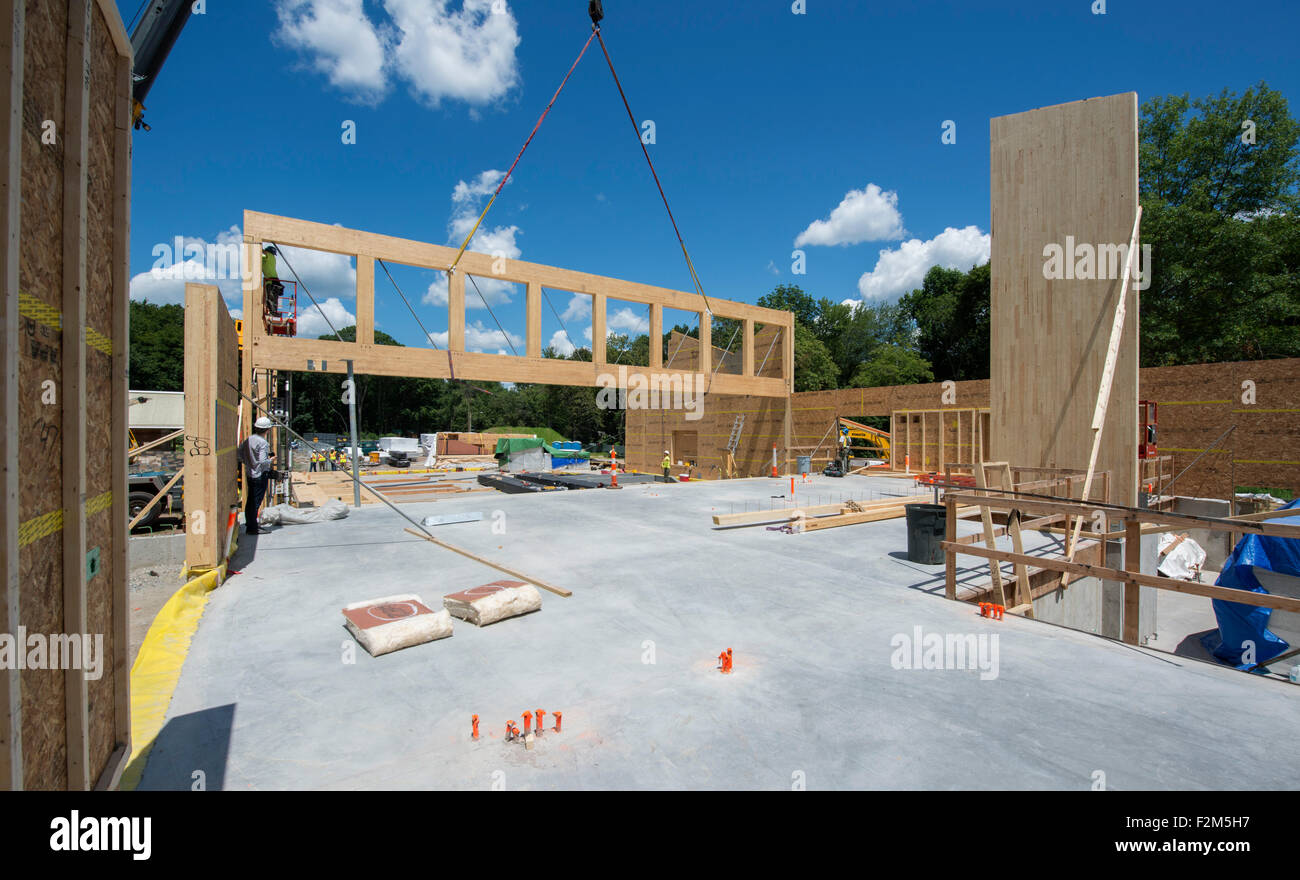 16,000 pound wooden engineered timber trusses await installation by ...