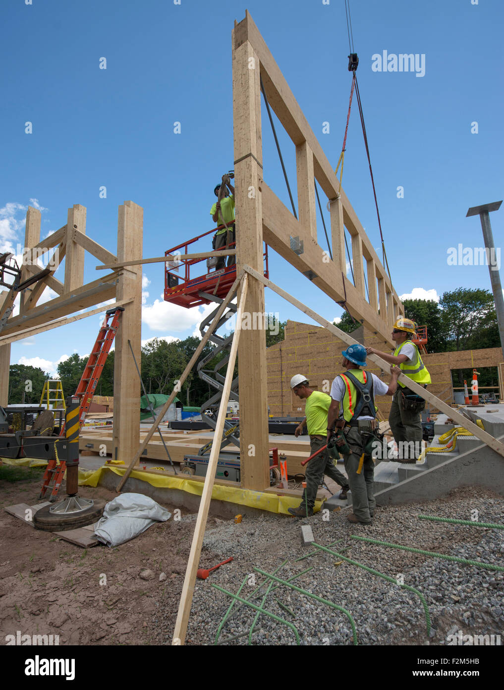 16,000 pound wooden engineered timber trusses await installation by ...