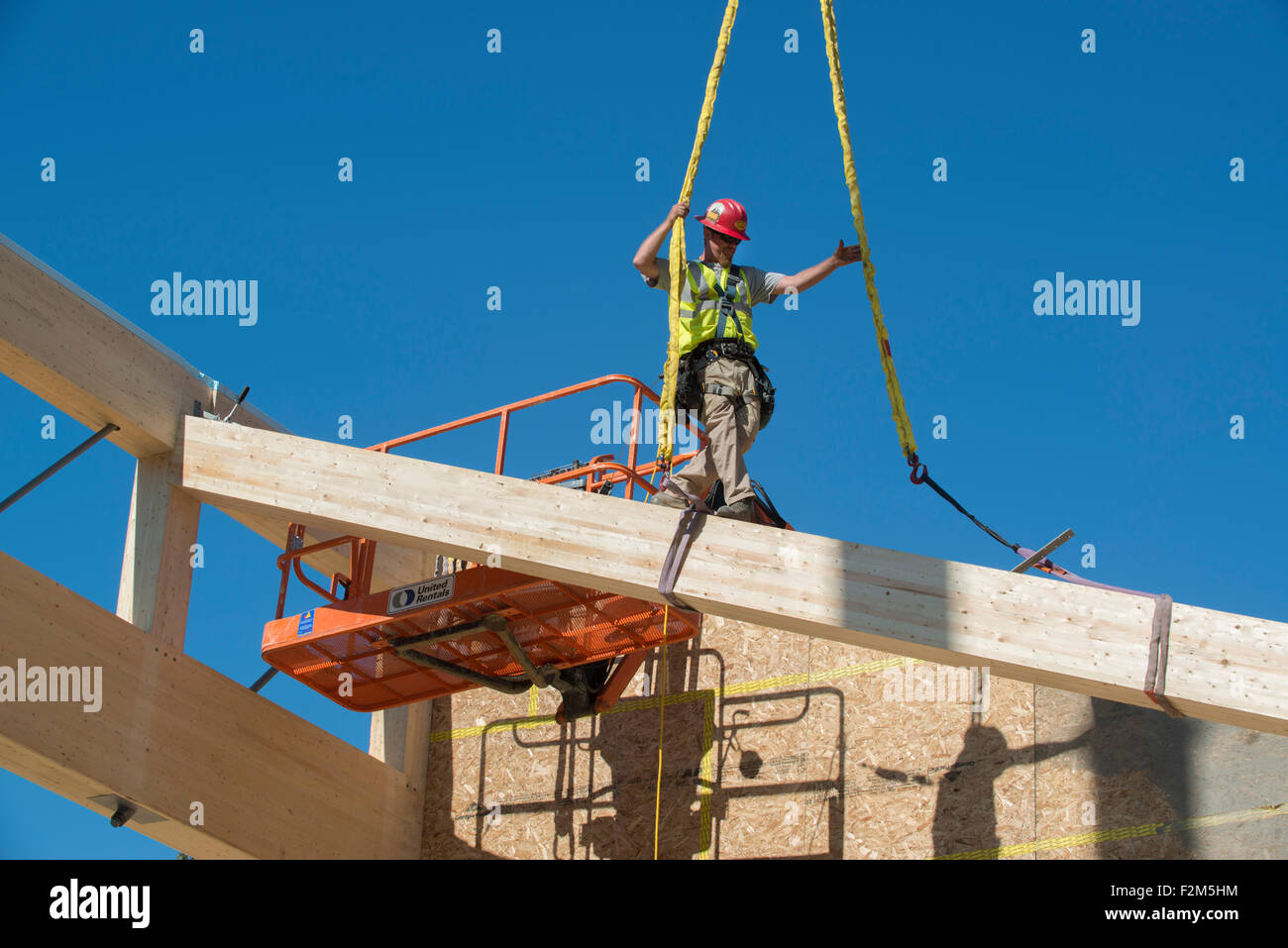 16,000 pound wooden engineered timber trusses await installation by ...