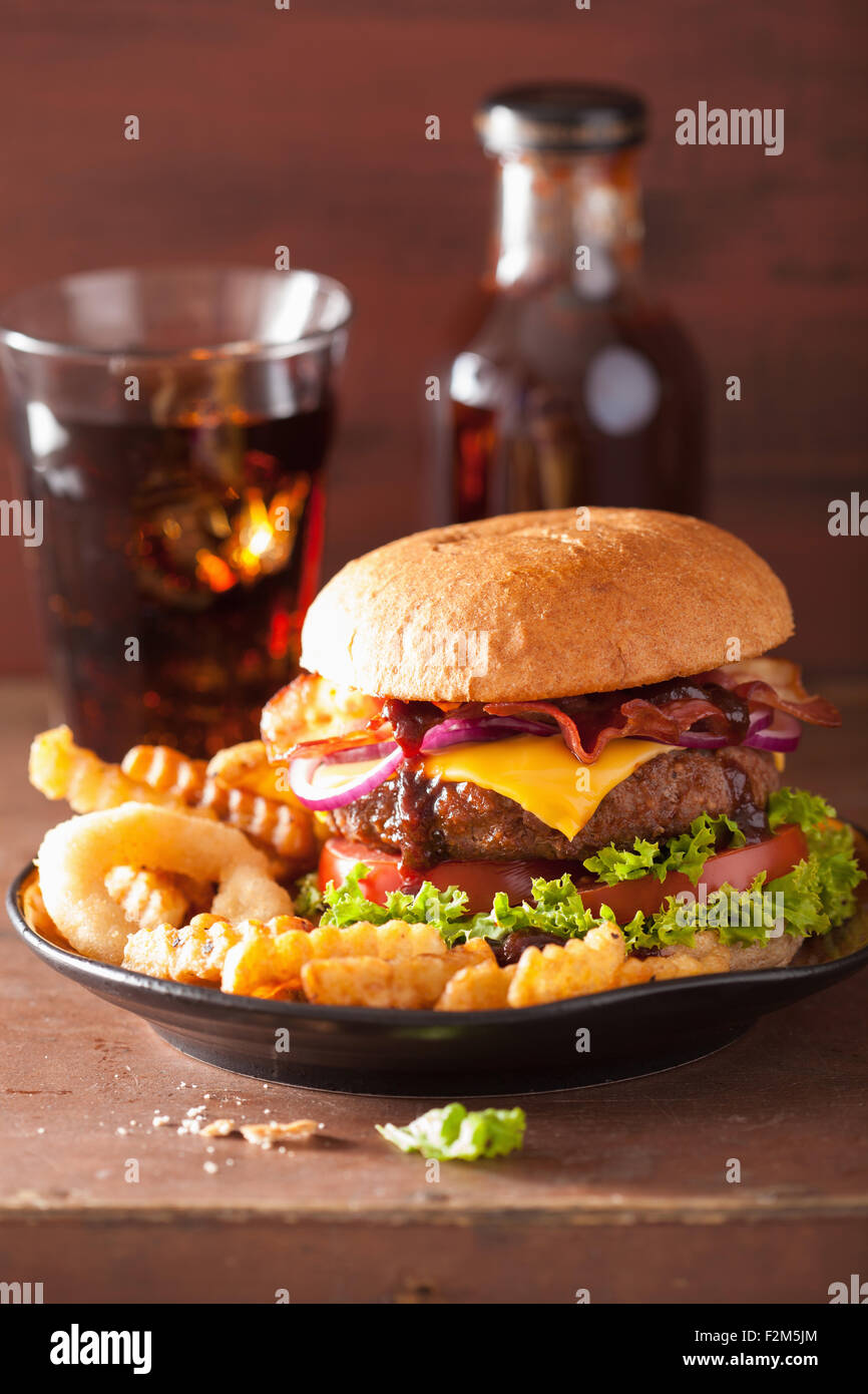 bacon cheese hamburger with beef patty tomato onion Stock Photo - Alamy