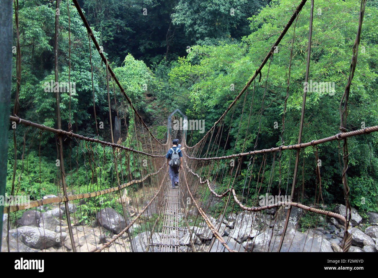 A hanging suspension bridge spans two banks in Meghalaya, India Stock Photo Alamy