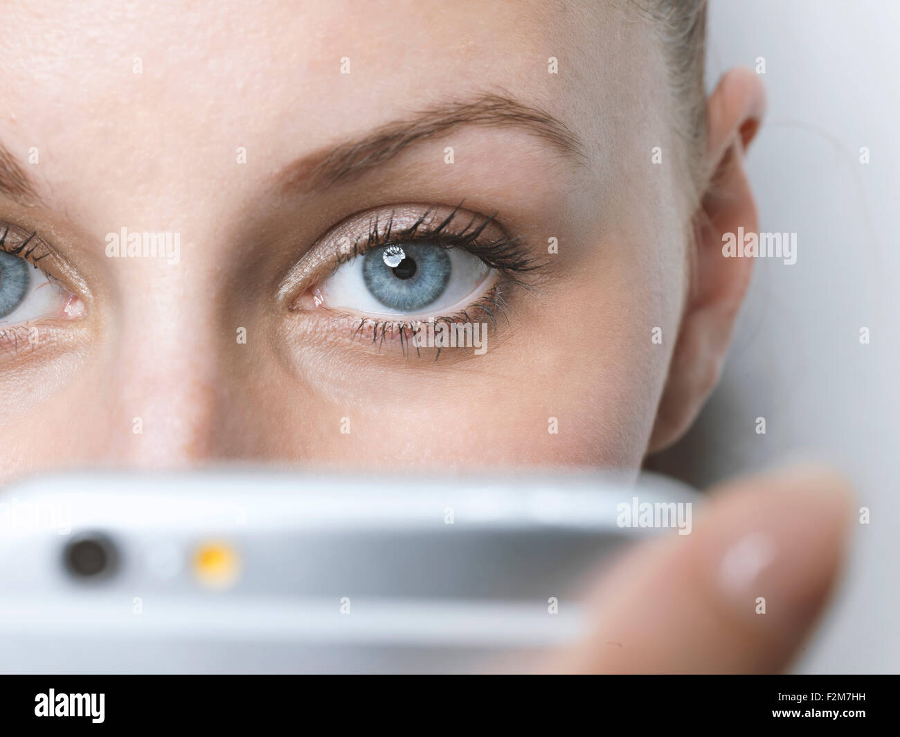 Close-up of woman with cell phone Stock Photo