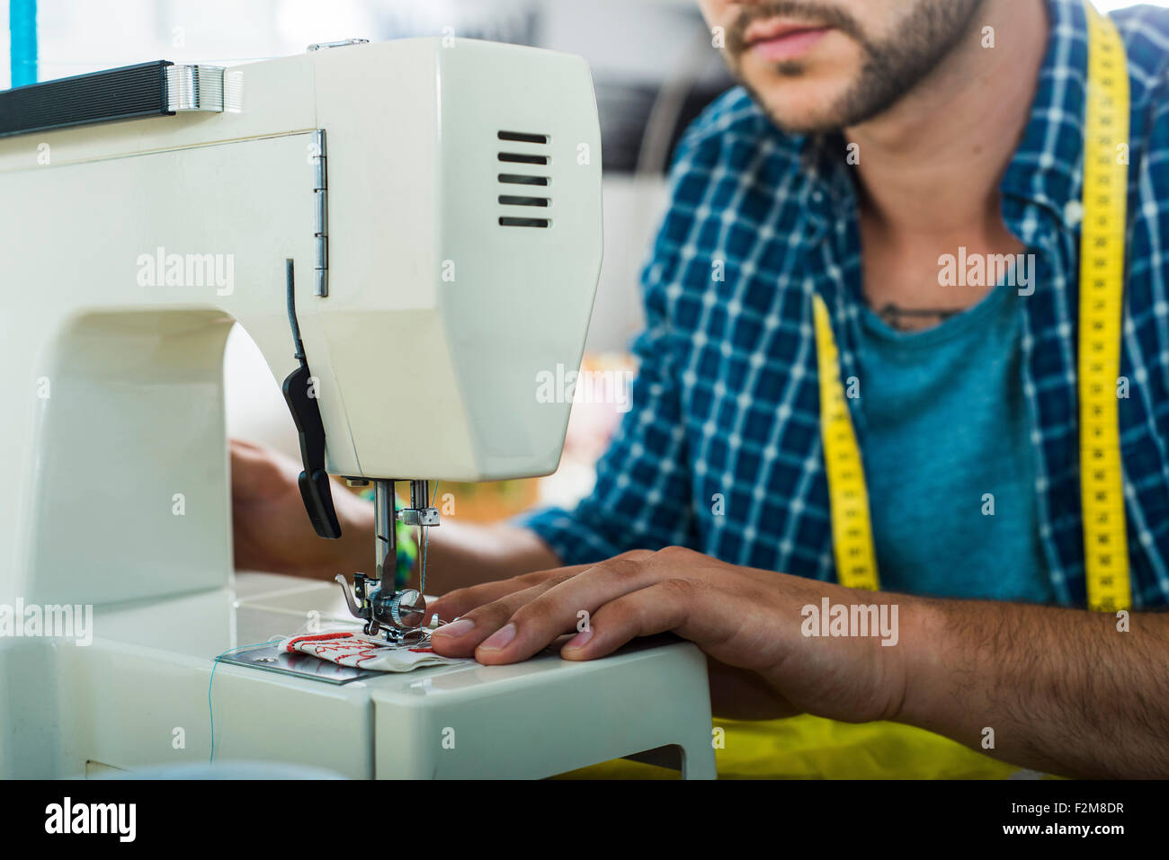 Close up man using sewing machine hi-res stock photography and images ...