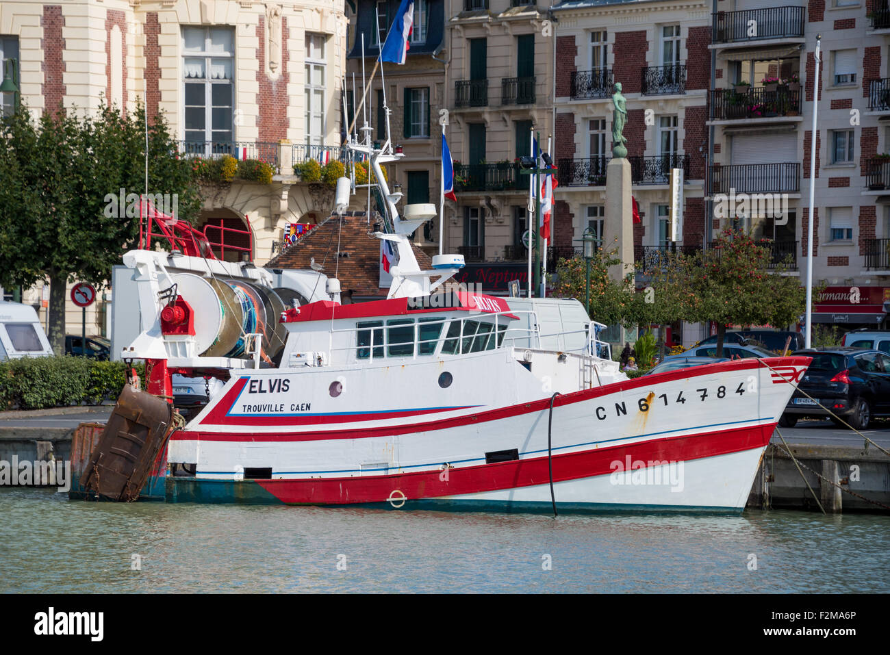 A Trawler boat moored along the quayside  at  Trouville Normandy Northern France Stock Photo